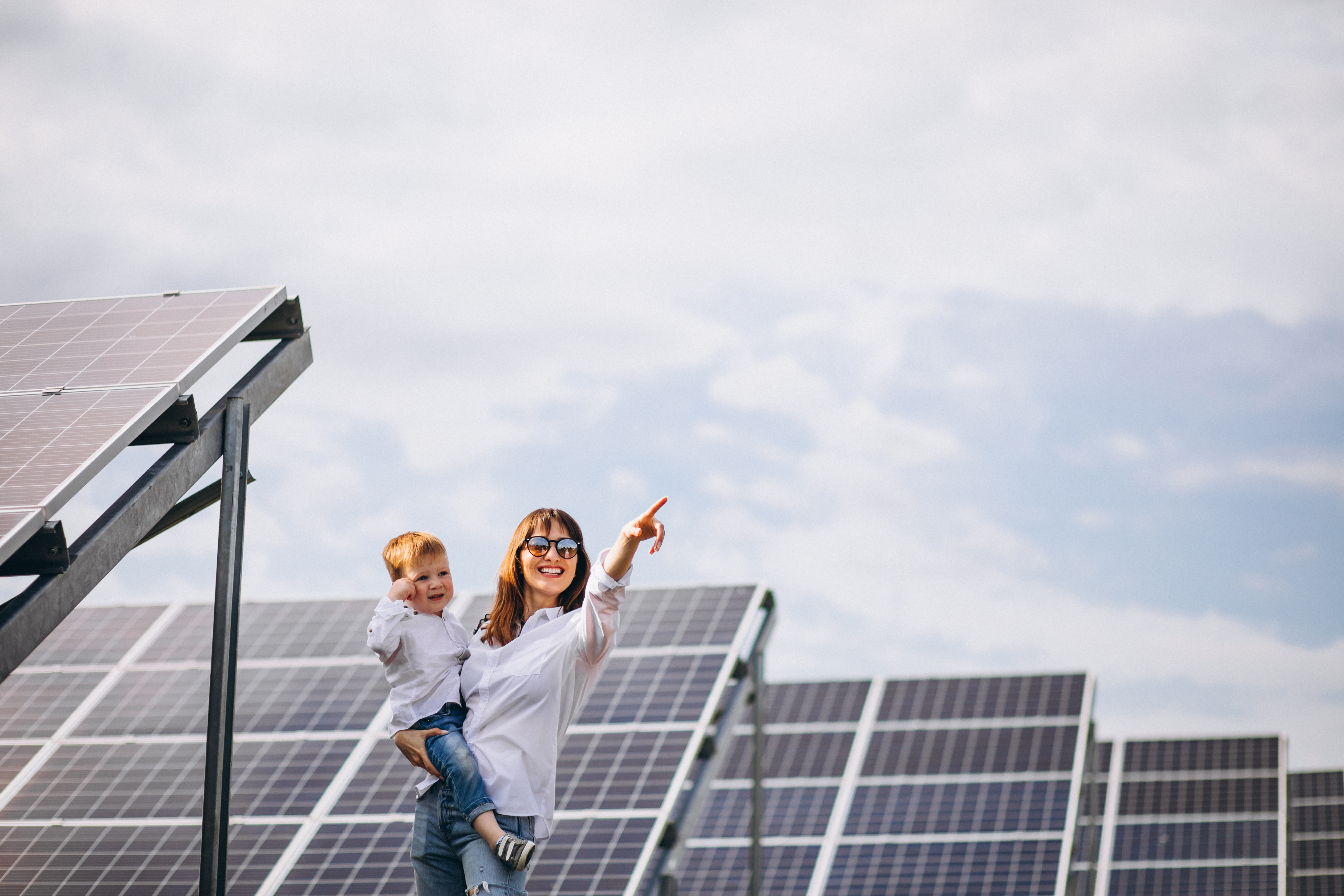 mother-with-her-little-son-by-solar-panels.jpg